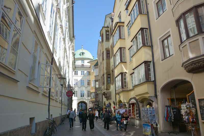 Hofgasse in the old town of Innsbruck, with the imperial Hofburg in the background.